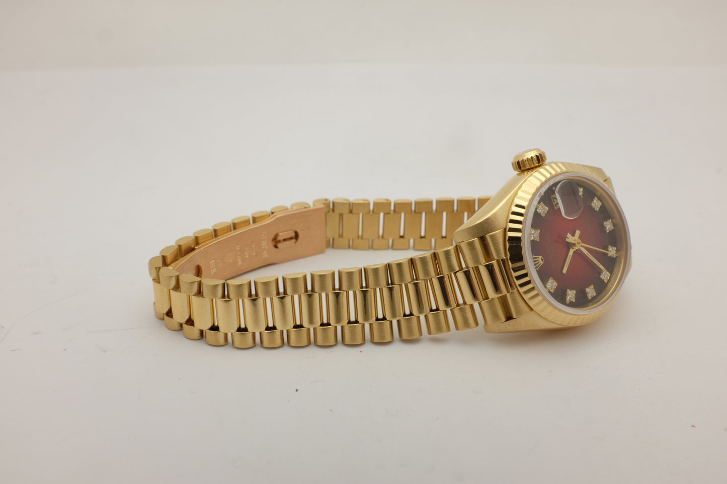 Rolex Oyster Perpetual Date 18kt Yellow Gold Factory Ombre Red Diamond Dial 26MM 69178