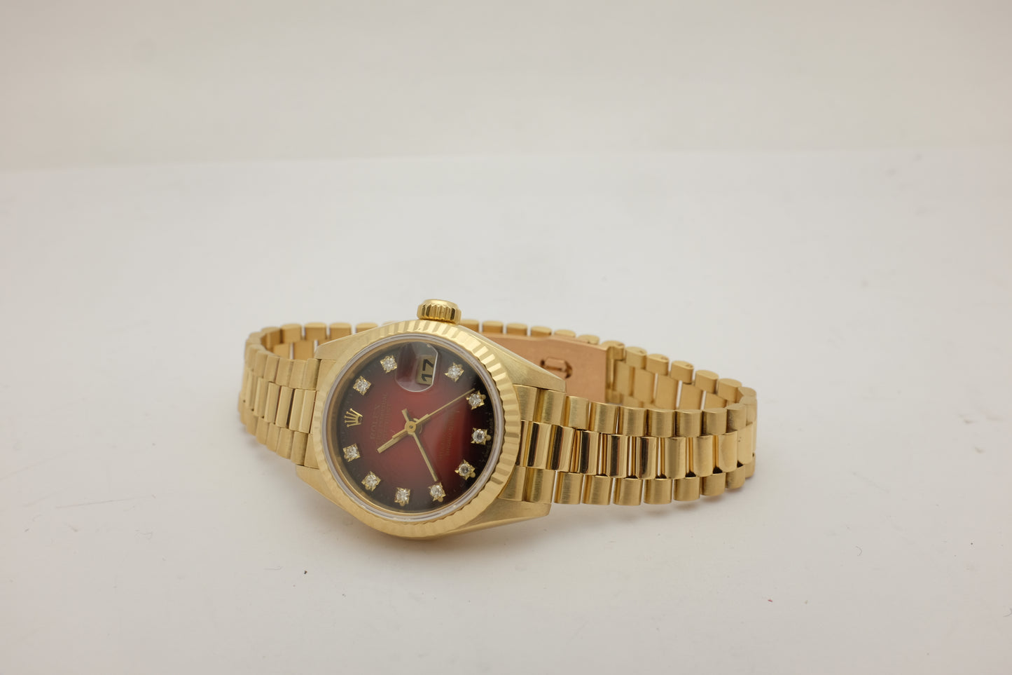 Rolex Oyster Perpetual Date 18kt Yellow Gold Factory Ombre Red Diamond Dial 26MM 69178